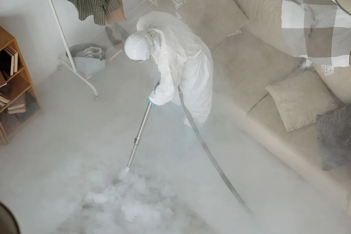 Biohazard cleanup technician in protective equipment, Eupora, MS